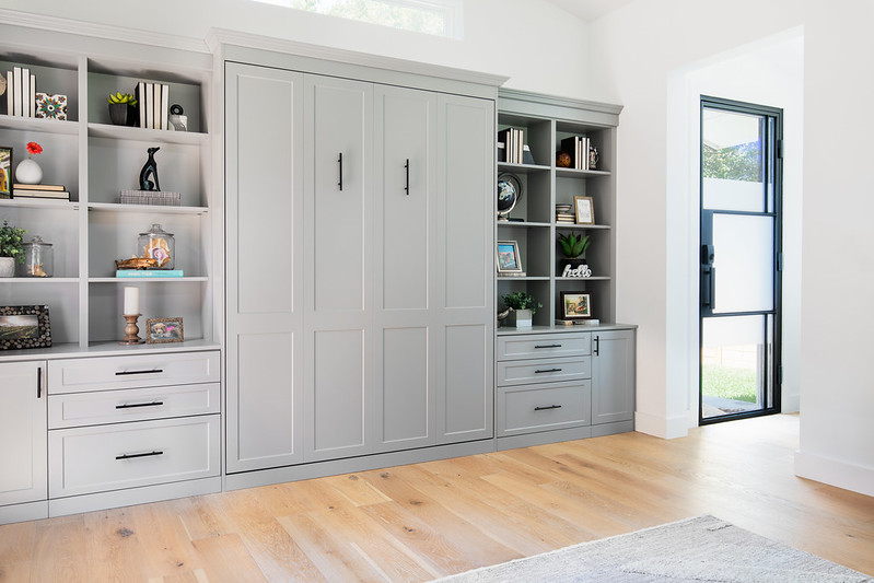 Closed Murphy bed with shelving.